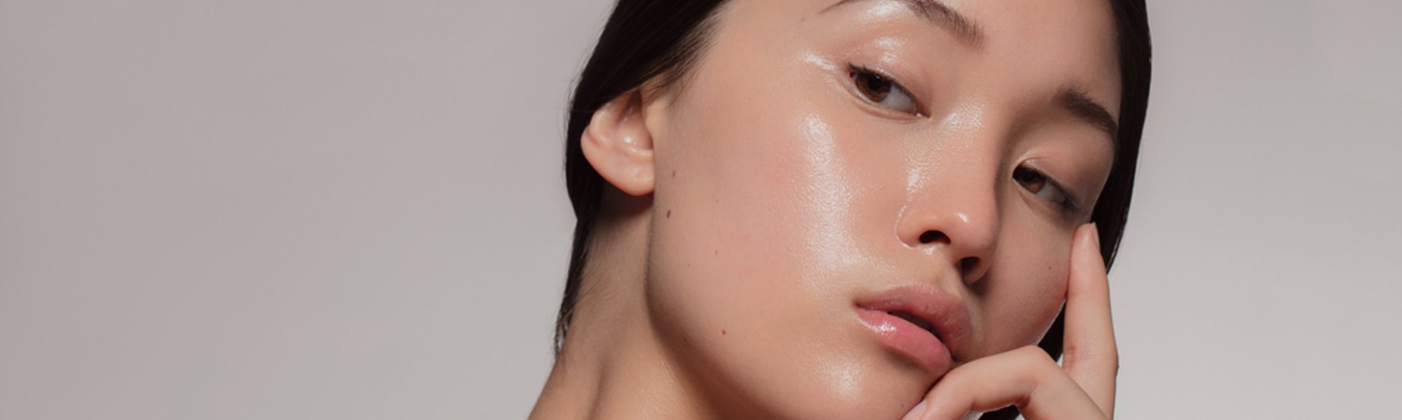 young asian woman with glowing skin