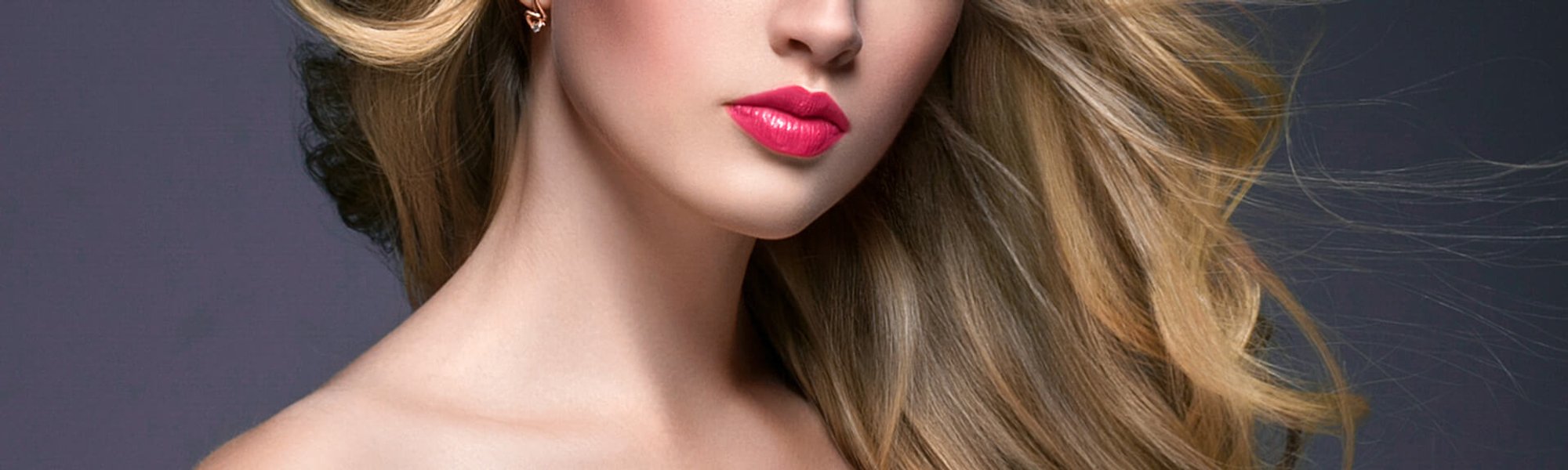 gorgeous woman with hair highlights and bright red lipstick