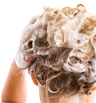 woman's hair with shampoo